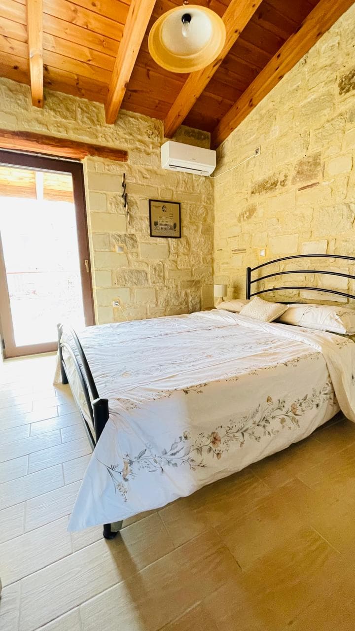 Intimate double room with wooden beams