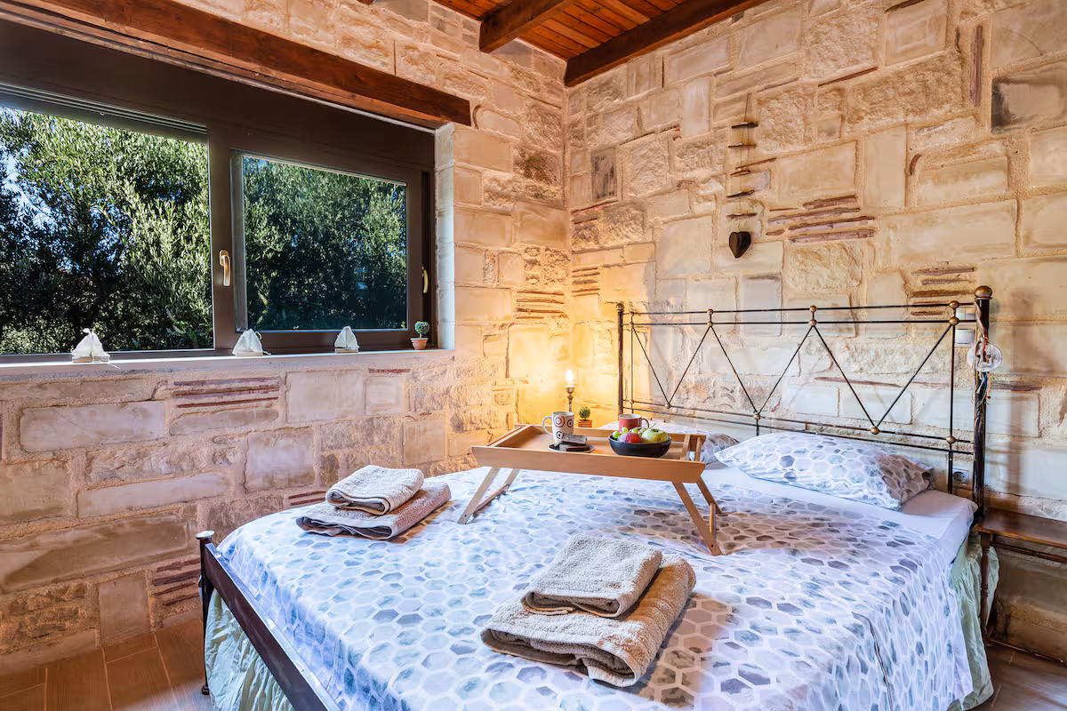 Studio sleeping area with garden views